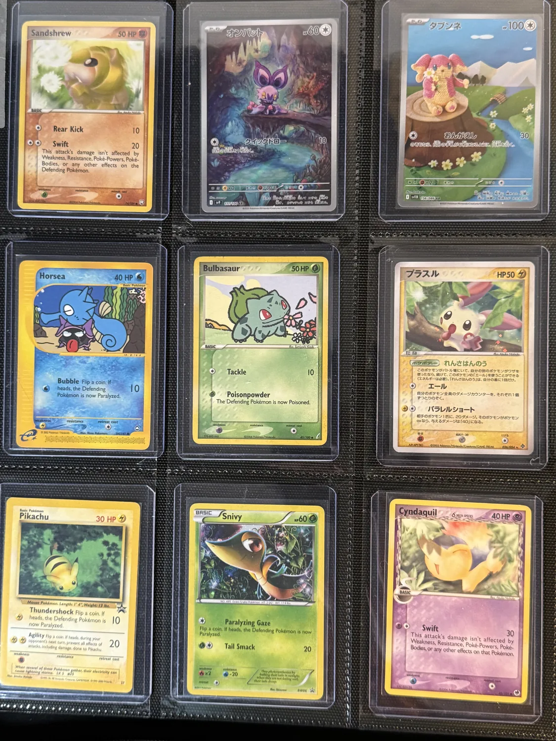 Nine-pocket binder page holding Audino, Bulbasaur, Cyndaquil, Horsea, Pikachu, Plusle, Sandshrew, Snivy, Woobat