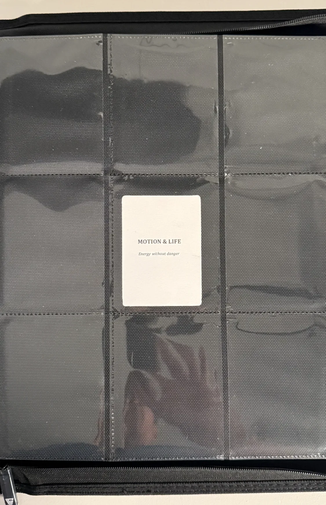 Motion and Life chapter divider card seated in a binder page