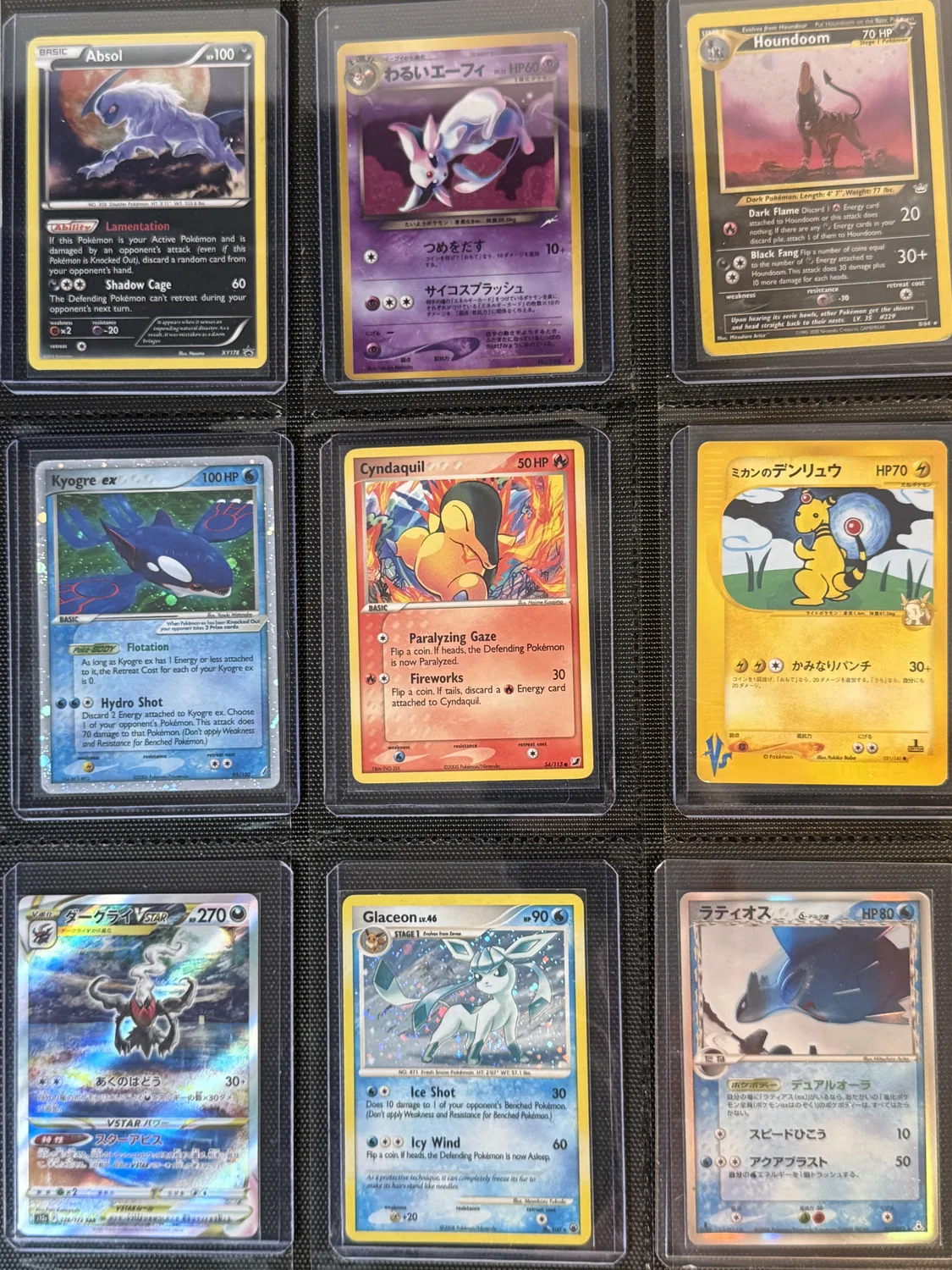 Nine-pocket binder page holding Absol, Ampharos, Cyndaquil, Darkrai, Espeon, Glaceon, Houndoom, Kyogre, Latios