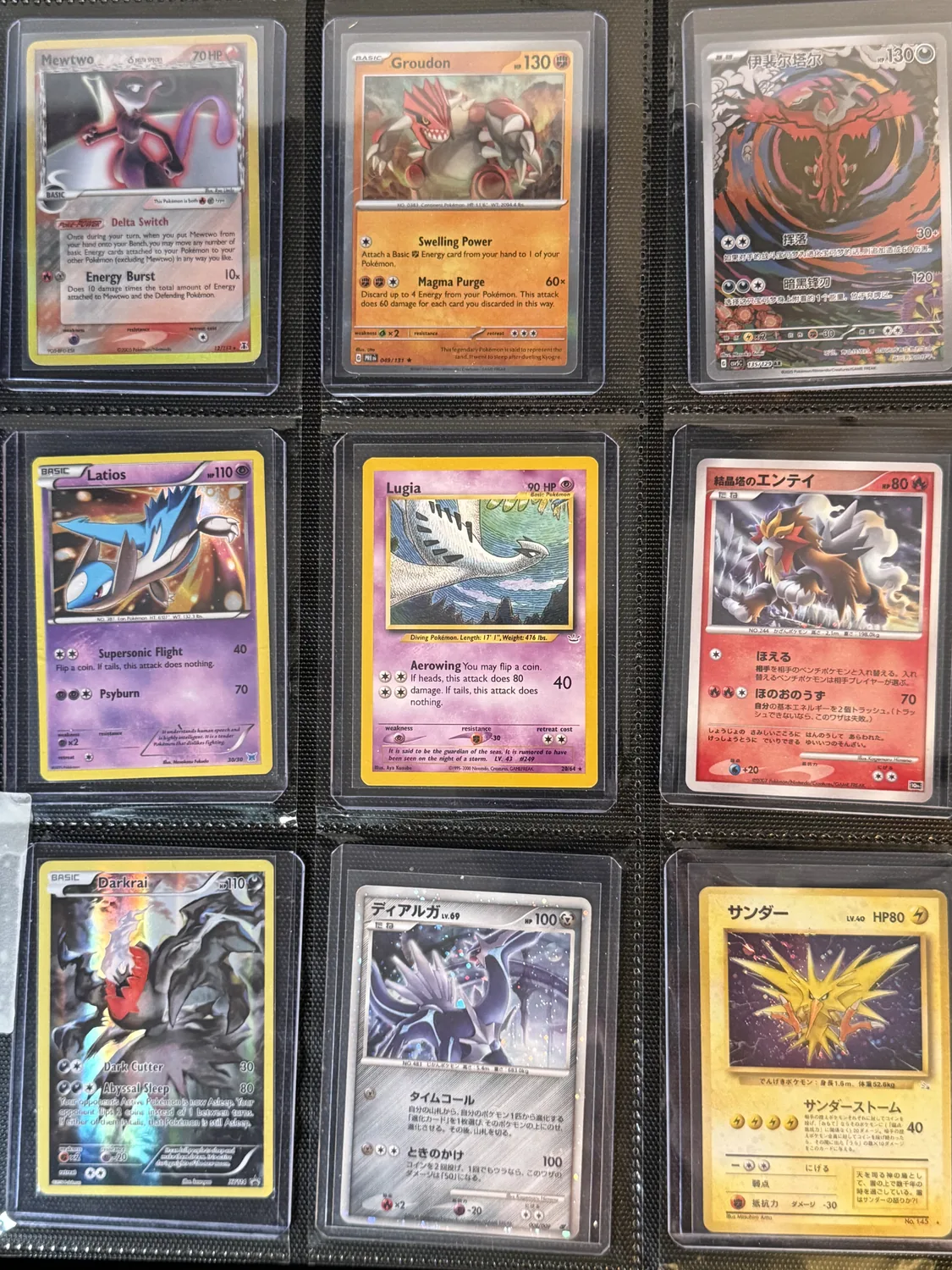 Nine-pocket binder page holding Darkrai, Dialga, Entei, Groudon, Latios, Lugia, Mewtwo, Yveltal, Zapdos